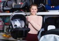 housewife with infant& x27;s car cradle Royalty Free Stock Photo