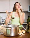 Young housewife cooking first dish in her life