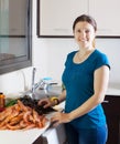 Young housewife cooking seafood Royalty Free Stock Photo