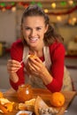 Young housewife eating homemade orange jam
