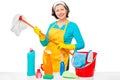 A young housewife with a mop and cleaning agents Royalty Free Stock Photo