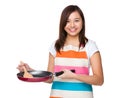 Young housewife using frying pan Royalty Free Stock Photo