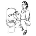 Young housewife washing the toilet in gloves