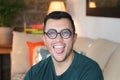 Young humorous man with old fashioned eyeglasses