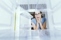 Desperate woman looking into her empty fridge Royalty Free Stock Photo