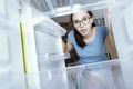 Desperate woman looking into her empty fridge Royalty Free Stock Photo