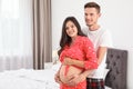 Young husband hugging his lovely pregnant wife Royalty Free Stock Photo