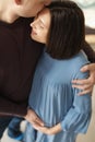 Young husband hugging his pregnant wife Royalty Free Stock Photo