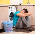 Young husband man doing laundry at home Royalty Free Stock Photo