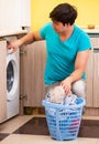 Young husband man doing laundry at home Royalty Free Stock Photo