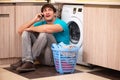 The young husband man doing laundry at home Royalty Free Stock Photo