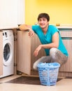 Young husband man doing laundry at home Royalty Free Stock Photo