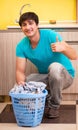 Young husband man doing laundry at home Royalty Free Stock Photo
