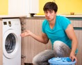Young husband man doing laundry at home Royalty Free Stock Photo