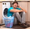Young husband man doing laundry at home Royalty Free Stock Photo