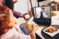 Ill couple having medical teleconsultation using laptop at home Royalty Free Stock Photo