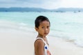 Young impoverished asian boy at white beach on Boracay Royalty Free Stock Photo