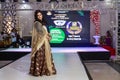 Young India girl performing ramp walk in fashion show