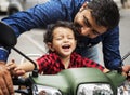 Young Indian boy riding the motorbike