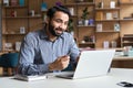 Young indian business man talking, having virtual meeting working on laptop. Royalty Free Stock Photo