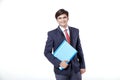 Young Indian businessman holding document file over white background