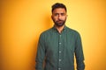 Young indian businessman wearing elegant shirt standing over isolated white background depressed and worry for distress, crying Royalty Free Stock Photo