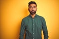 Young indian businessman wearing elegant shirt standing over isolated white background Relaxed with serious expression on face Royalty Free Stock Photo