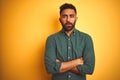 Young indian businessman wearing elegant shirt standing over isolated white background skeptic and nervous, disapproving Royalty Free Stock Photo