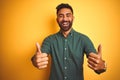 Young indian businessman wearing elegant shirt standing over isolated white background success sign doing positive gesture with Royalty Free Stock Photo