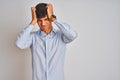 Young indian businessman wearing elegant shirt standing over isolated white background suffering from headache desperate and Royalty Free Stock Photo