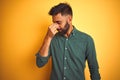 Young indian businessman wearing elegant shirt standing over isolated white background tired rubbing nose and eyes feeling fatigue Royalty Free Stock Photo