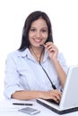 Young Indian call centre woman with headset Royalty Free Stock Photo