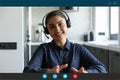 Young indian ethnicity businesswoman in headset holding video call. Royalty Free Stock Photo