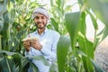 young indian farmer at corn field. Royalty Free Stock Photo