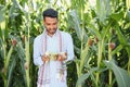 young indian farmer at corn field. Royalty Free Stock Photo
