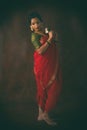 Young Indian female in red traditional saree