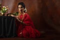 Young Indian female wearing Maharashtrian style red saree