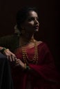 Young Indian female wearing Maharashtrian style red saree