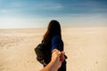 Young indian girl in black dress walking on the rann of kutchh gujarat india Royalty Free Stock Photo