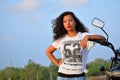 Young Indian girl posing with motorcycle, Pune Royalty Free Stock Photo