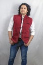 Young indian male model wearing red jacket