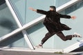 Young Indian man jumping in an urban context Royalty Free Stock Photo