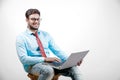 Young Indian man on spectacles and using laptop Royalty Free Stock Photo