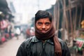Young Indian man wrapped in a scarf