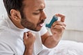 young indian patient using asthma inhaler Royalty Free Stock Photo