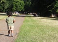 A Young Indian Toddler walking in garden