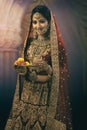 Young Indian woman in bridal wear