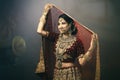 Young Indian woman in bridal wear