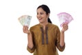 Young Indian woman holding currency notes agianst white Royalty Free Stock Photo