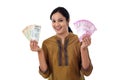 Young Indian woman holding currency notes agianst white Royalty Free Stock Photo